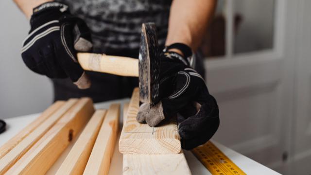 Hammering a nail into timber