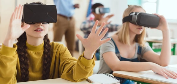Students wearing VR headsets in a classroom