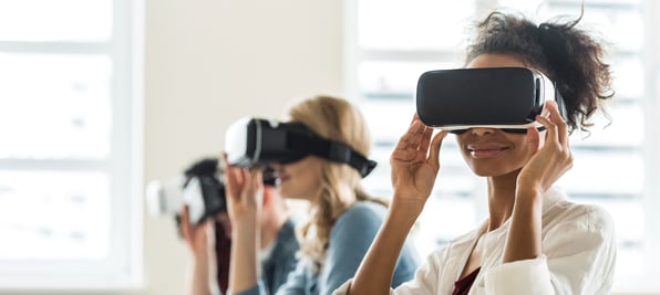 A group of students wearing VR headsets in a classroom