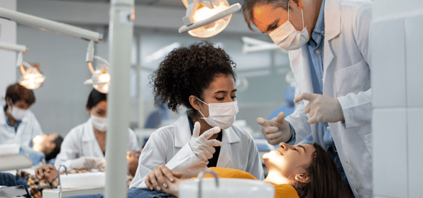 Dentist in training working on patient