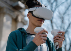 Boy using VR headset in nature