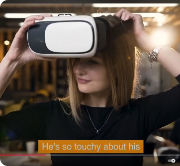 Screenshot of a young female putting on a VR headset