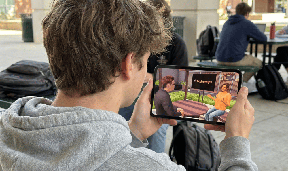 Man looking at iPad with Bodyswaps showing on the screen