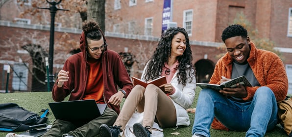 Students sitting on the lawn at university